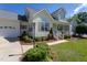 Attractive two-story home with a well-kept lawn, and a two-car garage at 1009 Open Field Dr, Garner, NC 27529