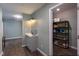 Hallway area featuring a beverage bar and a glimpse into a utility storage room with shelving for organized storage at 1009 Open Field Dr, Garner, NC 27529