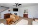 The living room features a fireplace, wood piano, an area rug and comfortable furniture at 1009 Open Field Dr, Garner, NC 27529