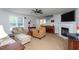 Cozy living room with neutral paint, a fireplace, and several seating options at 1009 Open Field Dr, Garner, NC 27529