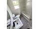 Updated bathroom featuring modern fixtures, a tub and shower combo, and bright natural light at 102 Allen St, Graham, NC 27253