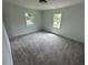 Spacious carpeted bedroom with freshly painted white walls and plenty of natural light at 102 Allen St, Graham, NC 27253