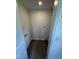 Compact laundry room with connections for washer and dryer, and dark wood look flooring at 102 Allen St, Graham, NC 27253