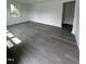 Stylish living room boasting sleek floors, freshly painted walls, and ample natural light at 102 Allen St, Graham, NC 27253