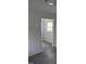 Bright living room featuring wood-look flooring and natural light from a window at 102 Allen St, Graham, NC 27253