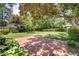 Backyard patio brick and landscaped grass, offering a serene outdoor space perfect for relaxation at 103 E Meadowbrook Dr, Smithfield, NC 27577