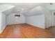 Attic bedroom with hardwood floors, a window with natural light, and trim on the walls at 103 E Meadowbrook Dr, Smithfield, NC 27577