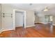 Spacious bedroom featuring a ceiling fan, hardwood floors, and closet for ample storage space at 103 E Meadowbrook Dr, Smithfield, NC 27577