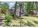 Charming two-story home with a landscaped front yard and dormer windows at 103 E Meadowbrook Dr, Smithfield, NC 27577