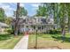 Charming two-story home with a landscaped front yard and dormer windows at 103 E Meadowbrook Dr, Smithfield, NC 27577
