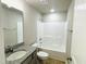 Bathroom featuring a granite vanity and a combined tub and shower at 107 Earnest Way, Kenly, NC 27542