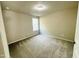Bedroom with neutral carpet, paint, and natural light; ideal for relaxation and personalization at 107 Earnest Way, Kenly, NC 27542