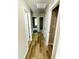 Inviting hallway featuring modern flooring leading to bedrooms and other spaces at 107 Earnest Way, Kenly, NC 27542