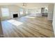 Open concept living room with modern floors, fireplace, and island at 107 Earnest Way, Kenly, NC 27542
