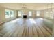 Bright and airy living space with a fireplace, ceiling fan, and kitchen bar at 107 Earnest Way, Kenly, NC 27542