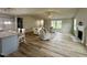 Living room with fireplace and wood-look flooring, ideal for Gathering gatherings and entertaining guests at 107 Earnest Way, Kenly, NC 27542