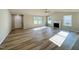 Spacious living room with a fireplace, ceiling fan, and plenty of natural light at 107 Earnest Way, Kenly, NC 27542