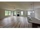 Spacious living room with many windows, recessed lighting, and a fireplace perfect for entertaining guests at 107 Earnest Way, Kenly, NC 27542