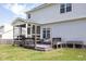 Spacious backyard featuring a deck, screened-in porch, and outdoor dining area at 110 Stoney Dr, Durham, NC 27703