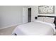 Cozy bedroom featuring a comfortable bed, soft lighting, and neutral décor at 110 Stoney Dr, Durham, NC 27703