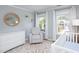 Charming Bedroom featuring ample natural light, a dresser, and a comfortable recliner at 110 Stoney Dr, Durham, NC 27703