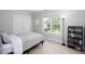 Bright bedroom with a large window, neutral walls, and carpet flooring at 110 Stoney Dr, Durham, NC 27703