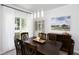 Elegant dining room boasting natural light, a decorative chandelier and a classic table at 110 Stoney Dr, Durham, NC 27703