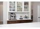 Close-up of the kitchen area with custom cabinets, stainless steel appliances, and decorative items at 110 Stoney Dr, Durham, NC 27703