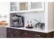 Close-up of the coffee bar area in the kitchen with stylish cabinets and modern appliances at 110 Stoney Dr, Durham, NC 27703