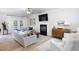 Bright living room with fireplace, hardwood floors, modern furniture, and french doors leading to the outside at 110 Stoney Dr, Durham, NC 27703