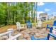 Backyard patio featuring comfortable seating around a fire pit at 113 Old Ballentine Way, Holly Springs, NC 27540