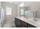 Bright bathroom with double vanity, ample counter space, and modern fixtures at 113 Old Ballentine Way, Holly Springs, NC 27540