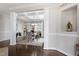 Elegant dining area with coffered ceilings, hardwood floors, and an open floor plan at 113 Old Ballentine Way, Holly Springs, NC 27540