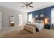Large main bedroom features an accent wall, plush carpeting, and ample natural light at 113 Old Ballentine Way, Holly Springs, NC 27540