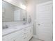 Modern bathroom with double sinks, elegant lighting, and neutral decor at 1180 Duke Farm Dr, Wake Forest, NC 27587