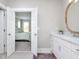 Bathroom features a vanity, opens to a bedroom with neutral decor at 1180 Duke Farm Dr, Wake Forest, NC 27587