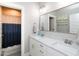 Well-appointed bathroom with double sinks, marble counters, and a private shower area at 1180 Duke Farm Dr, Wake Forest, NC 27587