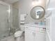 Bathroom features a glass shower enclosure, mirror and toilet at 1180 Duke Farm Dr, Wake Forest, NC 27587