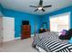 Bright bedroom with a four-poster bed, ceiling fan, and plenty of natural light at 1180 Duke Farm Dr, Wake Forest, NC 27587