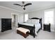Serene bedroom with dark furniture, including a dresser and bench, and neutral wall colors at 1180 Duke Farm Dr, Wake Forest, NC 27587
