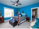 Vibrant bedroom with a four-poster bed, ceiling fan, and plenty of natural light at 1180 Duke Farm Dr, Wake Forest, NC 27587