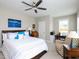 Comfortable bedroom featuring a ceiling fan, desk and large bed at 1180 Duke Farm Dr, Wake Forest, NC 27587