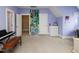 Bright bedroom with a succulent art piece, white trim and plush carpeting at 1180 Duke Farm Dr, Wake Forest, NC 27587