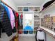 Walk-in closet with built-in shelving, hanging racks, and ample storage space at 1180 Duke Farm Dr, Wake Forest, NC 27587