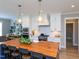 Stylish kitchen featuring a large island, white cabinets, modern appliances, and an open layout at 1180 Duke Farm Dr, Wake Forest, NC 27587