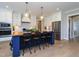 Well-equipped kitchen with a large island, stainless steel appliances, and sleek white cabinetry at 1180 Duke Farm Dr, Wake Forest, NC 27587