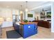 Bright kitchen featuring a blue island, stainless steel appliances, hardwood floors, and pendant lighting at 1180 Duke Farm Dr, Wake Forest, NC 27587