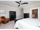 Calm bedroom with neutral tones, dark wood furniture, and an attached bathroom with a glass shower at 1180 Duke Farm Dr, Wake Forest, NC 27587
