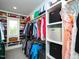 Organized walk-in closet with custom shelving and hanging rods at 1180 Duke Farm Dr, Wake Forest, NC 27587