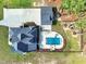 Aerial view showcasing the home's layout, outdoor pool, and surrounding landscape at 120 Lu Tom Ln, Wendell, NC 27591